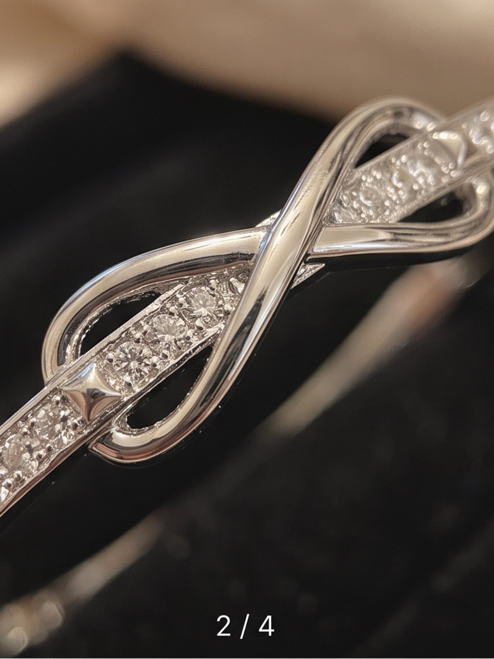 Elegant Infinity Knot Bangle Bracelet – Silver Plated CZ (7 Inches)